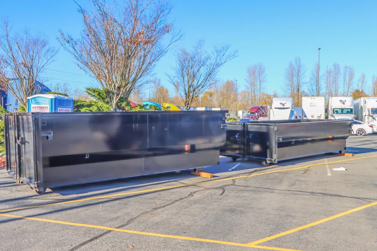 Professional dumpster rental service with roll-off container on residential driveway in Boiling Springs